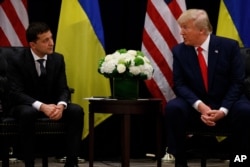 FILE - President Donald Trump meets with Ukrainian President Volodymyr Zelenskiy at the InterContinental New York Barclay hotel during the U.N. General Assembly, Sept. 25, 2019, in New York.