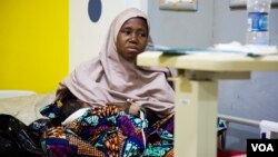 Aisha Suleiman, 32, breastfeeds her day-old child. She experienced postpartum hemorrhage during the delivery and lost three pints of blood.(Photo: Chika Oduah for VOA)