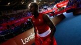 Julio la Cruz Peraza of Cuba arrives for his Men's Light Heavy (81kg) quarter-final boxing match against Brazil's Yamaguchi Falcao Florentino.