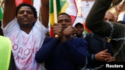 Ethiopian migrants, all members of the Oromo community of Ethiopia living in Malta, protest in Valletta against the Ethiopian regime's plan to evict Oromo farmers to expand Ethiopia's capital, Addis Ababa, Dec. 21, 2015.