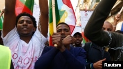 FILE - Ethiopian migrants, all members of the Oromo community of Ethiopia living in Malta, protest in Valletta against the Ethiopian regime's plan to evict Oromo farmers to expand Ethiopia's capital, Addis Ababa, Dec. 21, 2015.