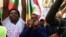 FILE - Ethiopian migrants, all members of the Oromo community of Ethiopia living in Malta, protest in Valletta against the Ethiopian regime's plan to evict Oromo farmers to expand Ethiopia's capital, Addis Ababa, Dec. 21, 2015.