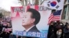 Supporters of impeached South Korean President Yoon Suk Yeol attend a rally to oppose his impeachment near the Constitutional Court in Seoul, South Korea, Feb. 25, 2025. The letters read, "The people's president."