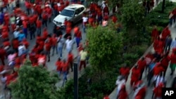 Members of the Economic Freedom Fighters party holds placards during their march for economic transformation outside the Johannesburg Stock Exchange in Johannesburg, Oct. 27, 2015.