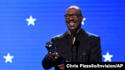 FILE - Eddie Murphy accepts the lifetime achievement award at the 25th annual Critics' Choice Awards in Santa Monica, Calif., Jan. 12, 2020. 