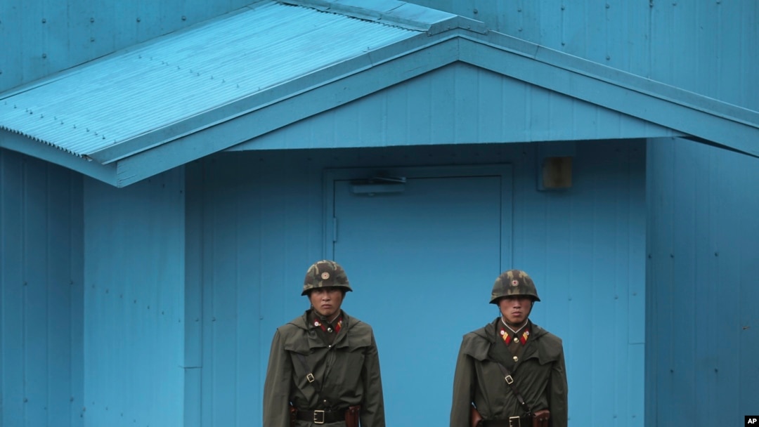 FILE - North Korean soldiers guard the truce village of Panmunjom at the Demilitarized Zone (DMZ) which separates the two Koreas.