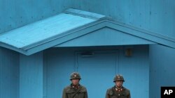 FILE - North Korean soldiers guard the truce village of Panmunjom at the Demilitarized Zone (DMZ) which separates the two Koreas.