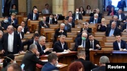 Hungarian Prime Minister Viktor Orban votes the law granting the government special powers to combat the coronavirus disease (COVID-19) crisis at the Hungarian parliament in Budapest, Hungary, March 30, 2020.