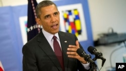 President Barack Obama answers a question regarding the situation in the Ukraine during his visit to unveil his 2015 budget at the Powell Elementary School in the Petworth neighborhood of Washington, March 4, 2014.