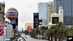 Las Vegas Boulevard is nearly empty, March 18, 2020, in Las Vegas.