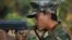 In this photo taken on Feb. 13, 2012, a Kachin soldier mans a frontline position, facing off against the Burmese government.
