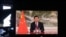 Chinese President Xi Jinping is seen on a TV screen speaking remotely at the opening of the WEF Davos Agenda virtual sessions at the WEF's headquarters in Cologny near Geneva on Jan. 17, 2022.