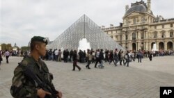 French soldiers patrol around the Louvre museum in Paris, Sunday, Oct. 3, 2010. The State Department has cautioned Americans traveling in Europe to be vigilant because of heightened concerns about a potential al-Qaida terrorist attack aimed at U.S. citize