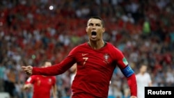 Christiano Ronaldo merayakan gol pertama dalam laga penyisihan Grup B melawan Portugal di Sochi, 15 Juni 2018.