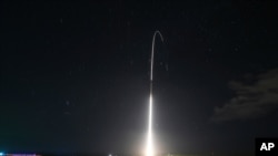 FILE - This Dec. 10, 2018, photo, provided by the U.S. Missile Defense Agency, shows the launch of a land-based Aegis missile defense system, that later intercepted an intermediate range ballistic missile launched from the Hawaiian island of Kauai.