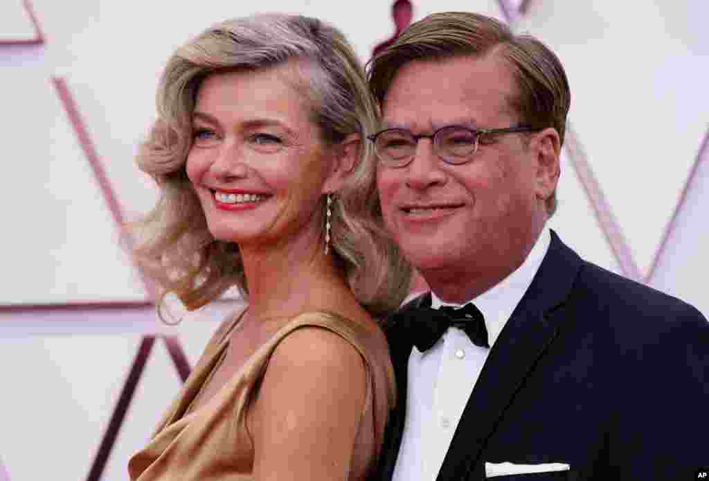 Paulina Porizkova, left, and Aaron Sorkin arrive at the Oscars on Sunday, April 25, 2021, at Union Station in Los Angeles. (AP Photo/Chris Pizzello, Pool)