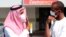 Men wear surgical masks as a precautionary measure against novel coronavirus, Dammam, Saudi Arabia, May 23, 2013.