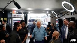 FILE - US President Joe Biden greets staff and patrons at Regal Lounge, a Men’s Barber & Spa, in Columbia, South Carolina, before speaking at the South Carolina’s First in the Nation Dinner at the South Carolina State Fairgrounds on January 27, 2024.