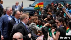 U.S. Vice President Kamala Harris interacts with children as she arrives at the Kotoka International Airport to begin her trip to Ghana, Tanzania and Zambia, in Accra, Ghana, March 26, 2023.