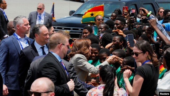 U.S. Vice President Kamala Harris interacts with children as she arrives at the Kotoka International Airport to begin her trip to Ghana, Tanzania and Zambia, in Accra, Ghana, March 26, 2023.