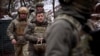 UKRAINE DEFENSE GOVERNMENT -- A handout photo made available by the Ukrainian presidential press service shows Ukrainian President Volodymyr Zelensky visiting positions on the frontline with pro-Russian militants in the Donetsk region, Ukraine, 06 Decembe