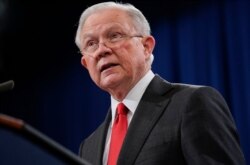Attorney General Jeff Sessions speaks during a news conference to announce a criminal law enforcement action involving China, at the Department of Justice in Washington, Nov. 1, 2018.