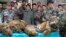 FILE - Thai Navy officers and forestry officials display seized dead tigers, leopards and pangolins in That Phanom district of Nakhon Phanom province, Thailand, Jan. 29, 2008. Conservation groups say Laos has promised to phase out tiger farms.