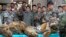 FILE - Thai Navy officers and forestry officials display seized dead tigers, leopards and pangolins in That Phanom district of Nakhon Phanom province, northeastern Thailand, Jan. 29, 2008. 