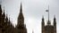 FILE - The British union flag flies at half-mast above Victoria Tower on the Palace of Westminster, in London, June 20, 2016.