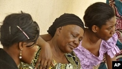 Relatives of victims of university theater gun attack in Kano, northern Nigeria, April 29, 2012.