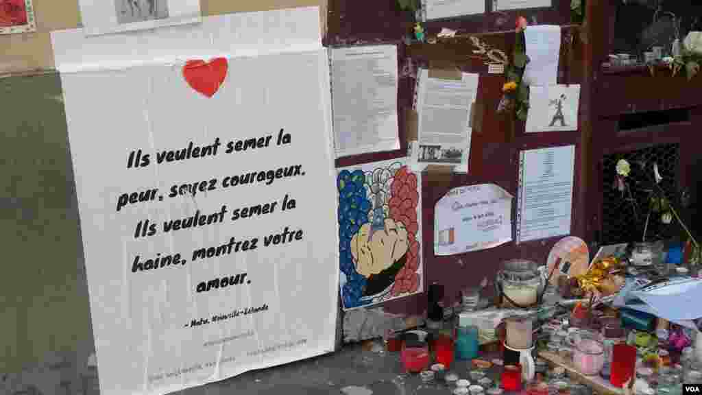 Poem by New Zealander next to Le Carillon bar, targeted in the November 13 attacks. (E. Bryant/VOA)