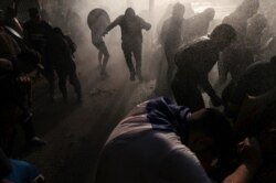 Chilean police clash with anti-government demonstrators in Santiago, Chile, Nov. 12, 2019.