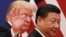 FILE - Chinese President Xi Jinping walks with U.S. President Donald Trump, Nov. 9, 2018, after attending a business event at the Great Hall of the People in Beijing. 