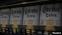 The logo of Corona beer, produced by a Group Modelo brewery in Mexico, is seen on a truck carrying bottles of beer in Mexico City, Jan. 27, 2017