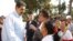 Venezuela's President Nicolas Maduro (L) talks with supporters during a mass at Miraflores Palace in Caracas, in this handout picture provided by Miraflores Palace on April 11, 2016. 