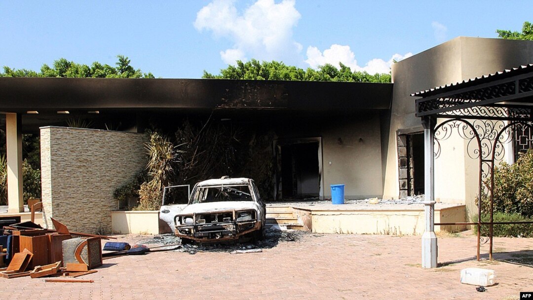 Burnt house, car inside U.S. embassy compound following overnight attack, Benghazi, Sept. 12, 2012.