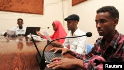 Qaran radio reporters broadcast morning news from their studio in Mogadishu, June 28, 2013. A report documents widespread violations in Somalia against journalists, human rights defenders and political leaders, including numerous killings, arbitrary arrests and detention, intimidation and closure of critical media outlets.