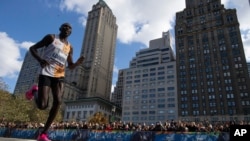 Geoffrey Kamworor, of Kenya, competes in the professional men's division during the New York City Marathon, Nov. 3, 2019, in New York.