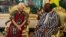 Australian Jocelyn Elliott, left, who was freed by al-Qaida captors, meets Burkina Faso President Roch Marc Christian Kaboré, right, at the presidential palace in Ouagadougou, Feb. 8, 2016.
