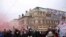 Demonstrators hold flags and placards as they march in front of the State Opera to protest against COVID-19 restrictions and the mandatory vaccination in Vienna, Austria, December 4, 2021. (REUTERS/Lisi Niesner)