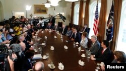 U.S. President Barack Obama (5th R) speaks at a meeting with bipartisan Congressional leaders in the Cabinet Room at the White House while discussing a military response to Syria, September 3, 2013.