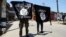 Young men carry Islamic State banners during an anti-government demonstration in Indian-administered Kashmir, June 27, 2015. (Credit: Tajamul Lone/VOA)