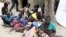 FILE - Residents displaced by fighting between government and rebel forces are seen at a World Food Program outpost in Kuernyang Payam, South Sudan May 2, 2015. 