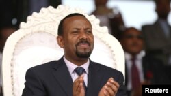 FILE - Ethiopia's prime minister, Abiy Ahmed, attends a rally during his visit to Ambo in the Oromiya region of Ethiopia, April 11, 2018. 