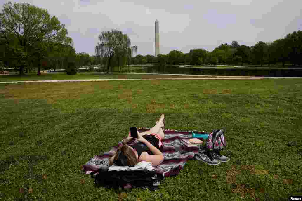 Chelsea Bruchs enjoys a nice day on the National Mall during the COVID-19 pandemic continues in Washington, D.C., April 29, 2020.