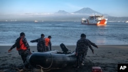 Indonesian navy personnel prepare for a search-and-rescue operation for victims of the sinking ferry KMP Yunicee near Gilimanuk Port on Bali Island, Indonesia, June 30, 2021.
