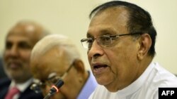Sri Lanka's parliament speaker Karu Jayasuriya, at right, looks on at a meeting of MPs at the Parliament Building in Colombo, Nov. 2, 2018.