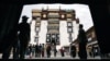 Pilgrims and tourists visit Potala Palace in Lhasa in Tibet Autonomous Region, July 5, 2006. 