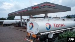 FILE - A Total petrol station is seen in Kampala, Uganda, Jan. 28, 2020. Uganda wants to build a pipeline to carry oil to the Tanzania coast. 