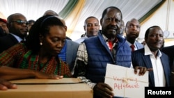 Kenya's opposition leader and presidential candidate Raila Odinga and his running-mate Martha Karua present a petition challenging the presidential election result at the Supreme Court in Nairobi, Kenya, August 22, 2022. 